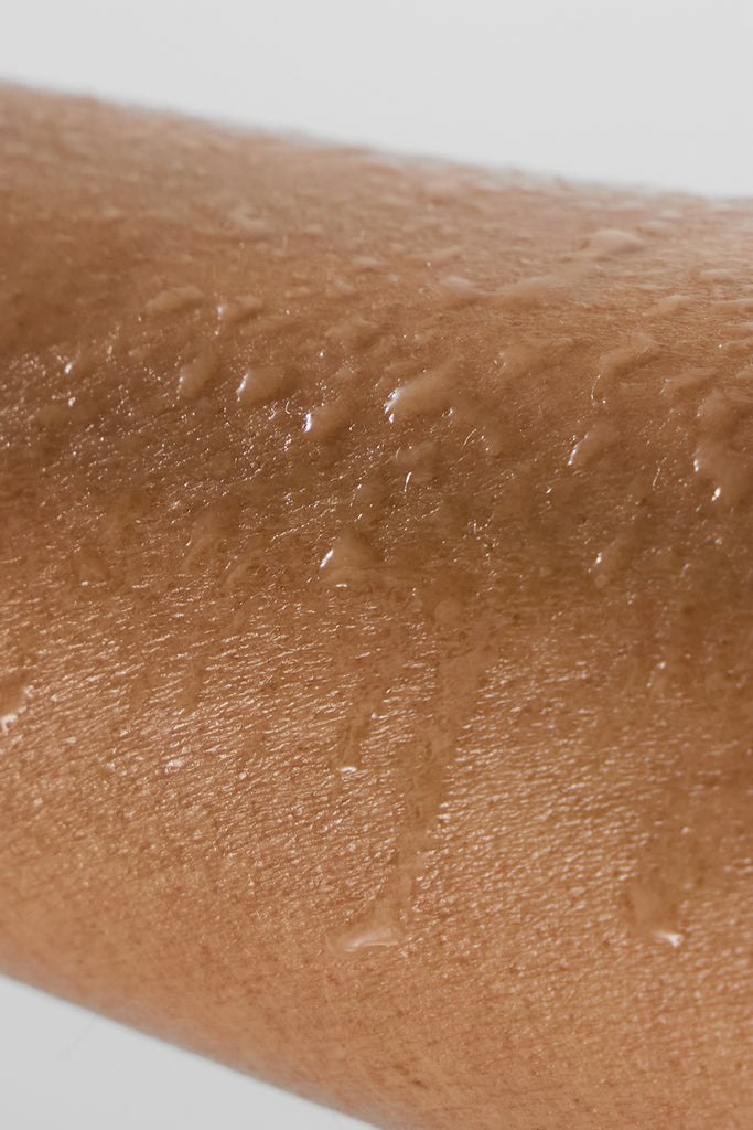 ALO Magnesium Reset Spray applied to skin