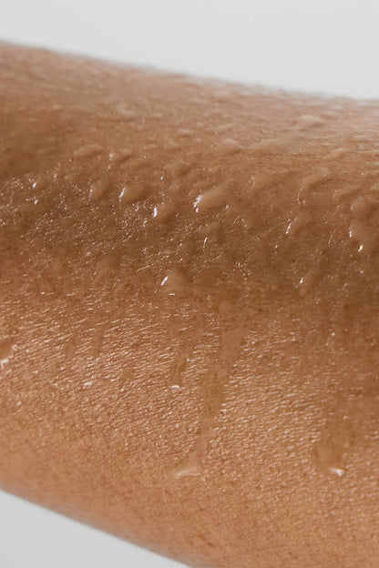 ALO Magnesium Reset Spray applied to skin