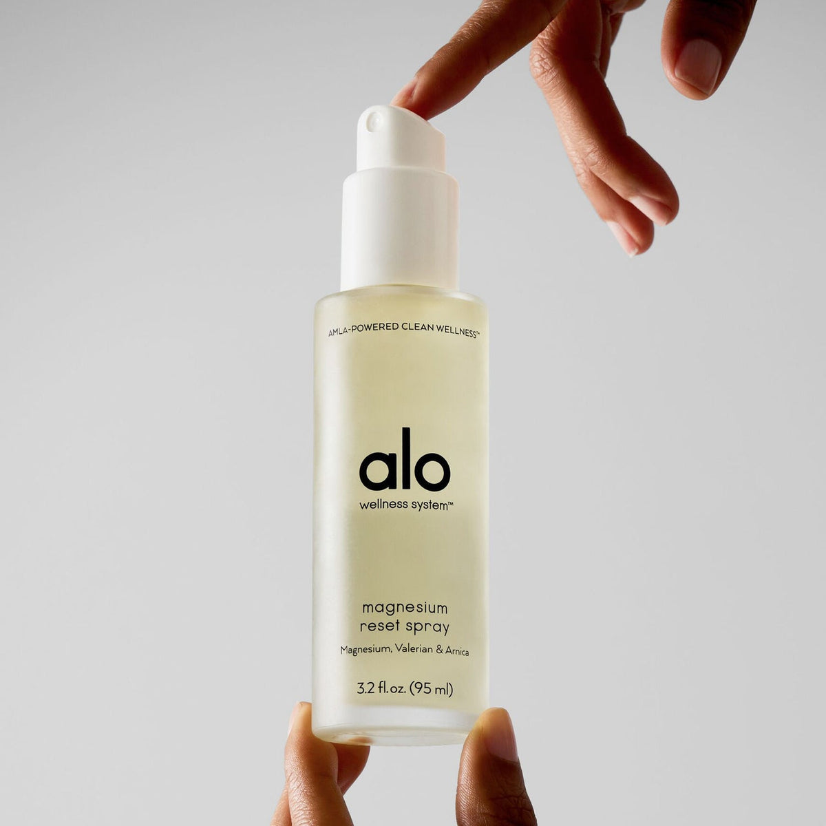 ALO Magnesium Reset Spray being applied